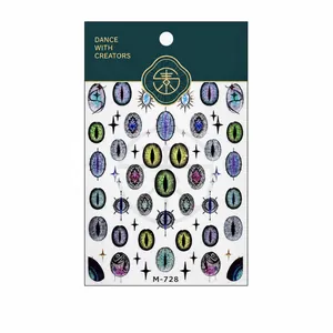 Glinsterende kattenoog nagelstickers in kosmische kleuren met gouden foliedetails