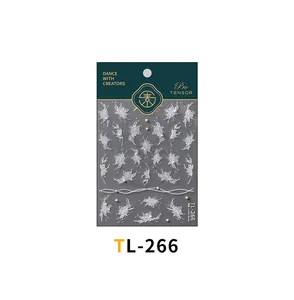 Detail showing 3D embossed floral and butterfly nail stickers with small pearl accents