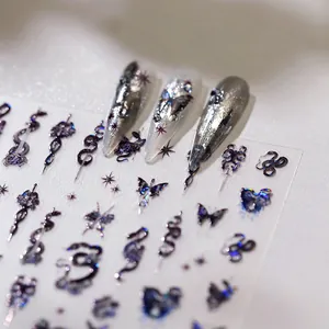 Dark gothic nail stickers with holographic snakes, butterflies, and crosses