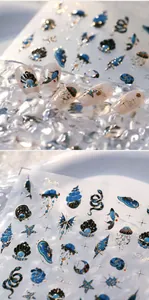 Detail of luxury ocean themed 3D nail stickers with blue jellyfish and gold shell designs
