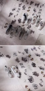 Macro view of M-715 nail art sticker with ink wash pattern and gold foil details