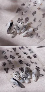 Detail of 3D embossed ink-style nail stickers with gold calligraphy and checkerboard