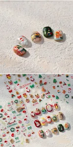 Detail of 3D Christmas nail stickers with Santa, reindeer and tree patterns