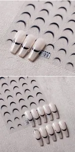 Detail of French gradient coffin nails with black tips, glitter, and rhinestone accents