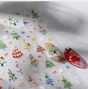Macro detail of 3D embossed Christmas tree nail stickers with glitter and snowflakes