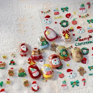 3D Christmas embossed nail art stickers featuring Santa, snowman, and gold foil motifs