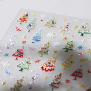 3D embossed Christmas nail art stickers featuring colorful trees and snowflakes