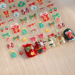 3D embossed Christmas nail stickers featuring festive red bows and holiday trees