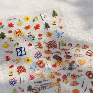 Autocollants nail art boulangerie d'automne avec motifs de pain et feuilles d'érable