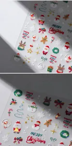 Close-up of 3D embossed Christmas nail stickers featuring Santa, elk, and snowflakes