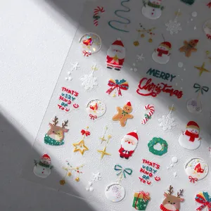 3D embossed Christmas nail art stickers featuring Santa, snowflakes, and gingerbread man