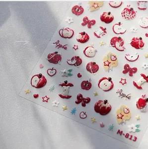 Detailed 5D embossed nail art sticker featuring cute red apples and ribbon bows M-813