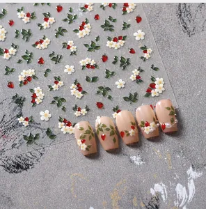 3D nail art stickers featuring red strawberry and white flower patterns on transparent base