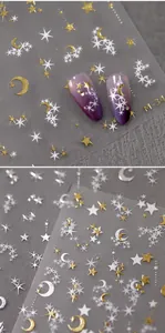 Macro view of M-34 starry sky nail stickers with gold stars and white moons on purple nails