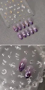 Detail of gold and silver starry sky nail decals with moon and star patterns