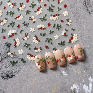 3D embossed nail art stickers with red strawberry and white flower patterns on nails