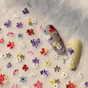 3D embossed floral nail stickers featuring colorful daisy and leaf patterns for DIY art