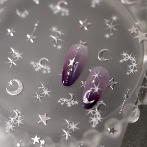 Star and moon nail art stickers with purple gradient and silver metallic accents