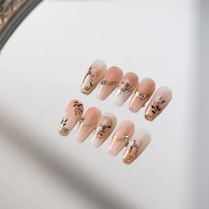 Handmade gradient pink floral press-on nails with rhinestones and gold accents