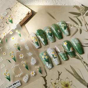 Detailed view of 3D embossed narcissus and butterfly nail art stickers with relief texture