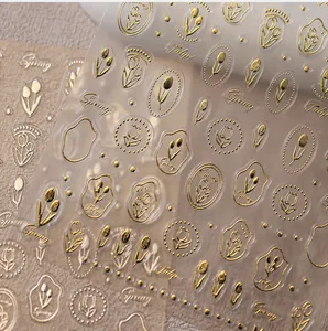 Detail of 3D embossed gold tulip nail stickers with Spring and Tulip metallic lettering