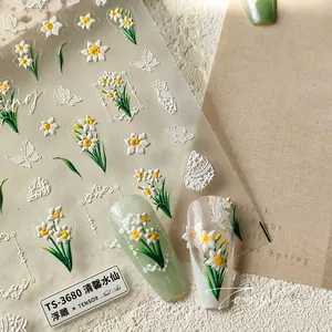 Detailed 5D embossed nail art stickers featuring narcissus and butterfly patterns