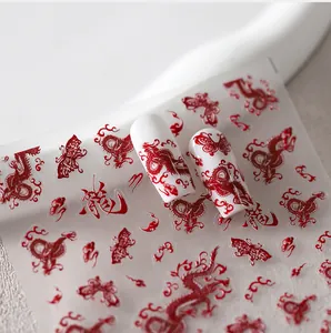 Detailed view of red Chinese dragon nail stickers with butterflies and floral motifs