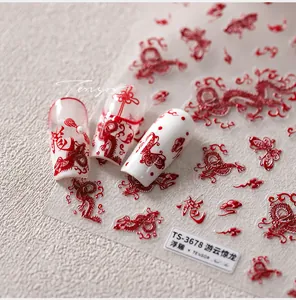 Detailed macro view of TS-3678 embossed red dragon nail art stickers on display