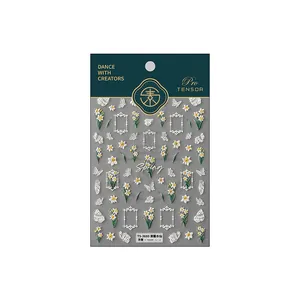 Embossed floral nail stickers with white narcissus and butterfly designs on packaging