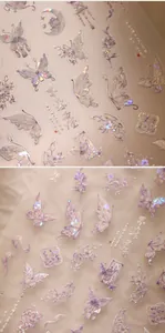 Macro detail of laser holographic nail stickers with butterfly and floral patterns