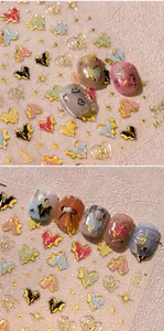 Macro detail of 3D embossed heart and star nail art stickers with metallic gold accents