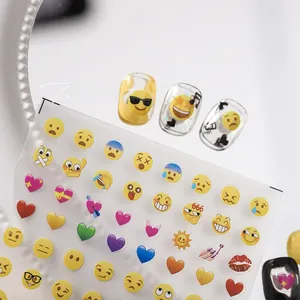 Detail of cute emoji and heart nail art stickers on a transparent backing film
