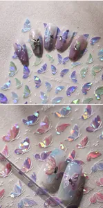 Macro view of iridescent laser butterfly nail art stickers with 3D rhinestone accents