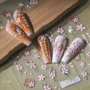 5D embossed nail art stickers with pink peach blossom designs and Chinese calligraphy