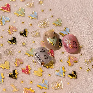 3D embossed heart nail stickers with metallic gold edges and colorful star motifs