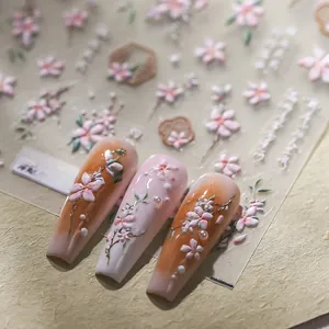 Macro shot of TS-3735 embossed 3D nail stickers featuring cherry blossoms and pearls