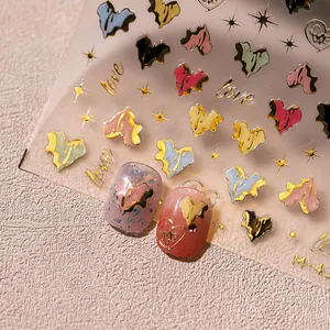 Irregular heart nail art stickers with metallic gold love lettering and shiny star motifs
