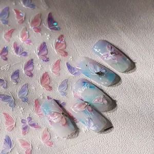 Sparkling butterfly nail art stickers with gold foil and gradient holographic design