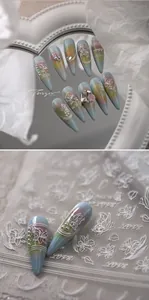 Detailed macro of 5D embossed floral nail art stickers with Morandi gradient textures