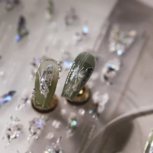 Green butterfly embossed nail stickers with silver lines and white pearls
