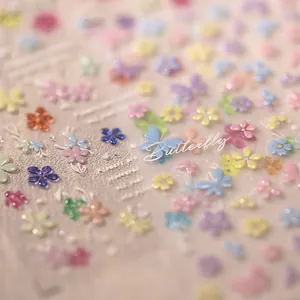 3D embossed butterfly and flower nail art stickers in pastel macaron colors with relief texture