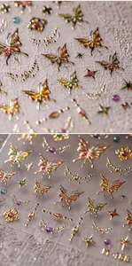 Détail macro de stickers ongles papillon 5D avec feuille d'or et motifs lune et étoiles 3D