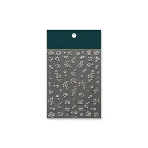 3D relief rose nail stickers in metallic champagne gold with textured floral patterns
