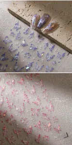 Detail view of M-450 laser holographic butterfly nail art stickers in blue and pink tones