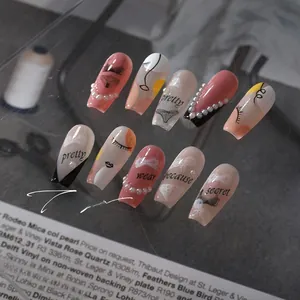 Detailed macro view of minimalist 5D nail art stickers with pink and black line art