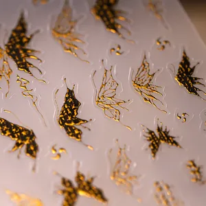 3D embossed gold and black butterfly nail art stickers with metallic texture finish