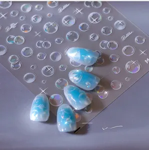 Macro detail of aurora bubble nail stickers with iridescent star patterns and 3D textures