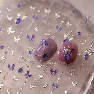 Macro detail of gothic silver butterfly nail stickers with purple glitter accents