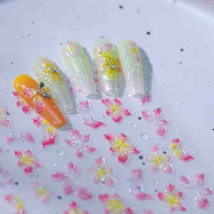 3D embossed floral nail stickers featuring pink yellow 5-petal flowers and water droplets