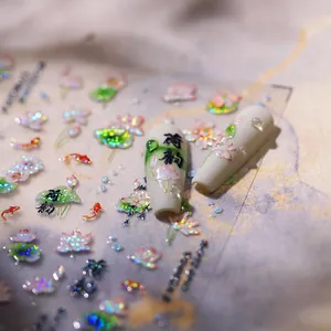 Artistic lotus and goldfish nail stickers with laser glitter finish on long white nails